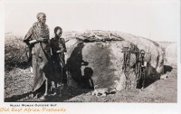 Masai Woman outside hut