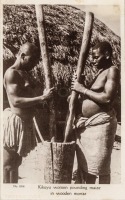 Kikuyu Women pounding maize in wooden mortar