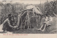 White ant Hill (boys catching ants). Uganda