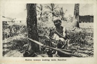 Native woman making mats