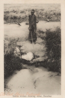 Native Woman drawing water, Zanzibar