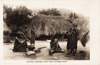 Natives cooking their morning ration